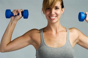 Female with weights, working out.